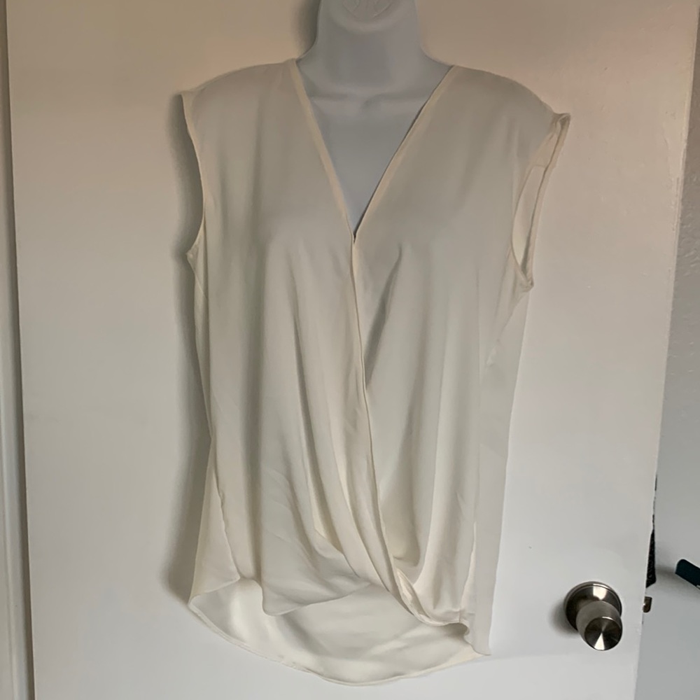 New without tags. Never worn. Off white blouse